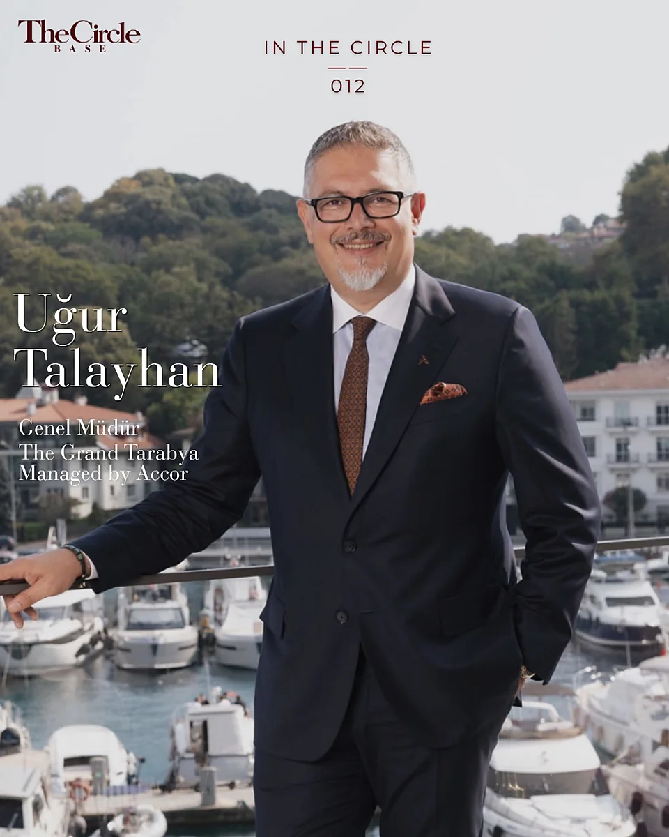Uğur Talayhan standing on a marina terrace overlooking the Bosphorus