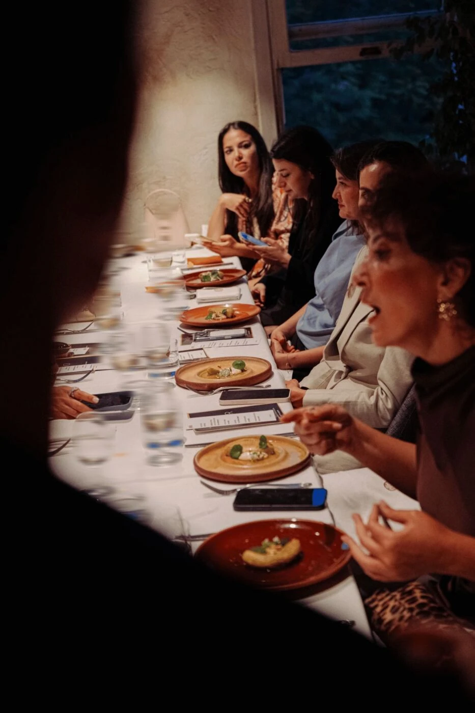 Guests mid-conversation around the table